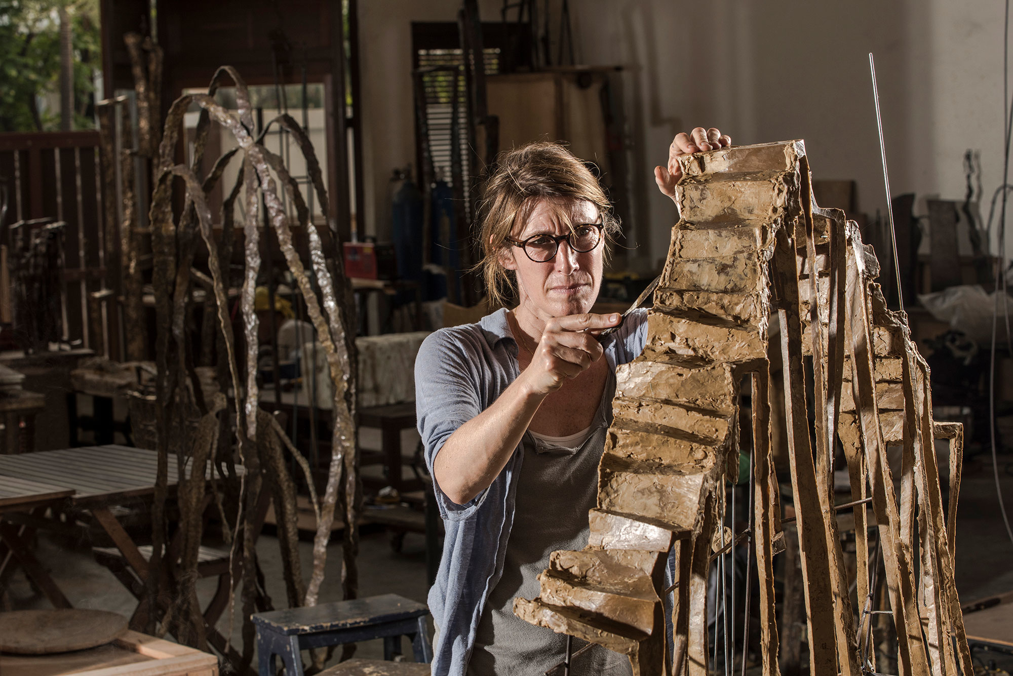 French sculptor Val - Valérie Goutard - in Bangkok studio working on “Le monde est vaste” with Sculptureval